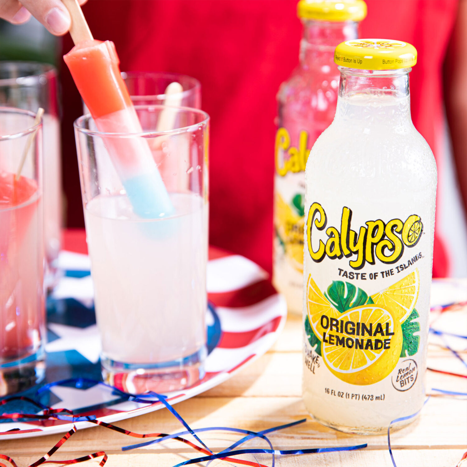 Calypso Original Lemonade with popsicles on a table.