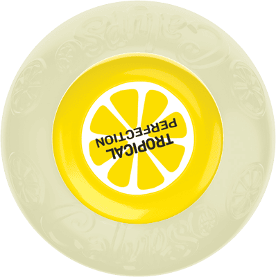 A yellow and white plate with a lemon slice design and the words "TROPICAL PERFECTION" printed upside down in the center.